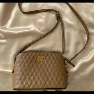 A medium sized Tan Crossed Body Purse